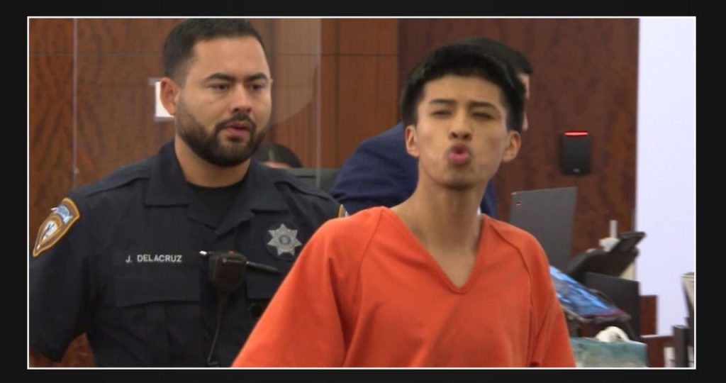 Teenager accused of murder sends air kisses in court